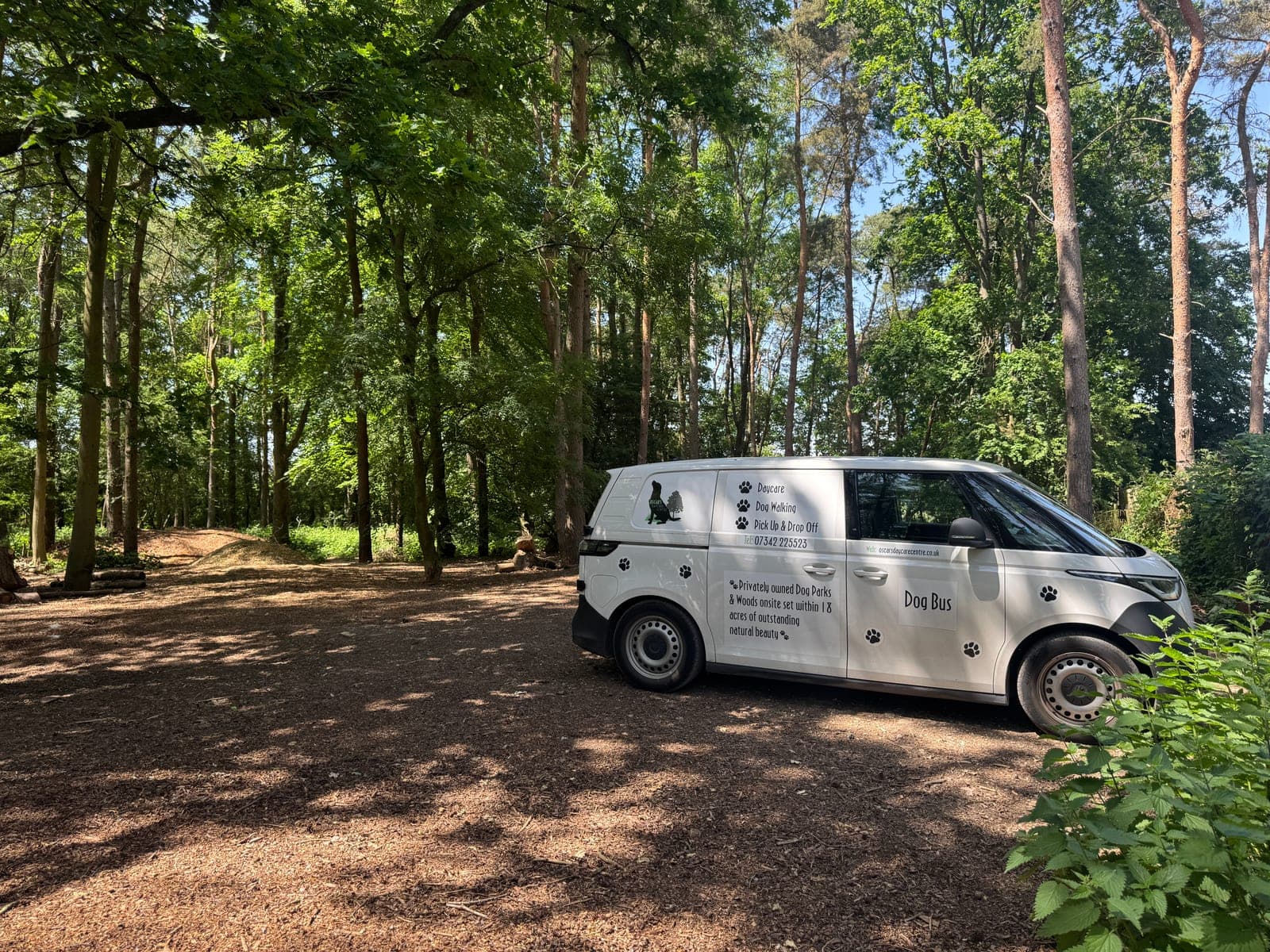 The K9 van parked in a clearing of tall pines at Wallaby Woods